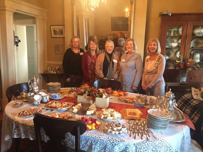 November tea committee ladies are pictured with the beautiful table